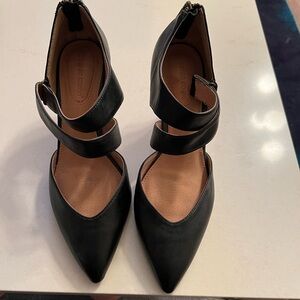 Black strappy heels with a zipper in the back. Size 8